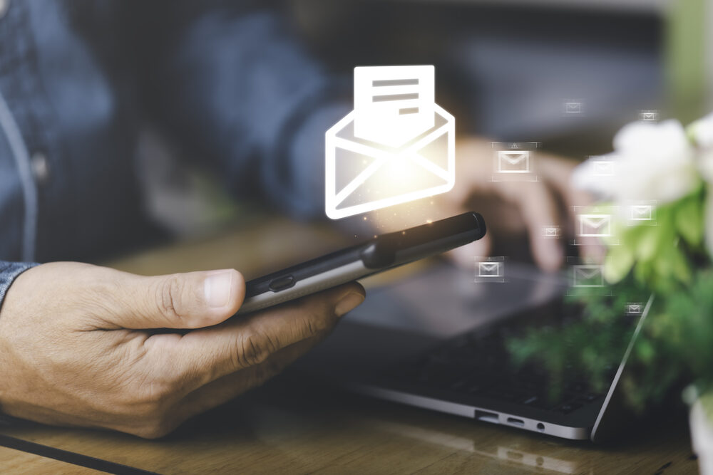 Person reading Industry News email updates on a smartphone